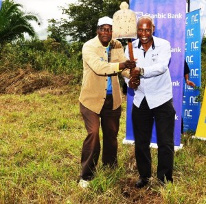 Fred Mugisha, Business Development Manager Stanbic Bank Uganda (right) and Abel Katahoire, Past President Rotary Club of Kampala North, break ground for the Youth Empowerment Project in Busunju Town Council on Saturday July 9.