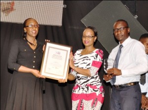 Stanbic Bank's Head of Digital Banking, Veronica Ssentongo (1st left), Ag. Marketing & Communications Manager Sonia Karamagi and Regional Services Manager David Matovu pose for a group photo after receiving awards on behalf of the Bank at the 2016 Digital Impact Awards