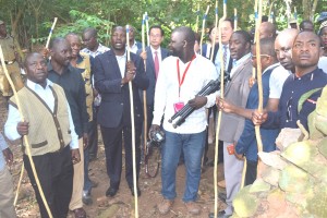 Minister of state for tourism Godfrey Kiwanda being showed the Henry Morton Stanley imcomplete building in the forest that could become an attraction for tourists if developed.