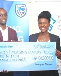 It's all smiles when Tabaro receives the dummy cheque from Cathy Adengo, the SBU Corporate and CSI Manager as a contribution to the Young and Emerging Leaders Project.