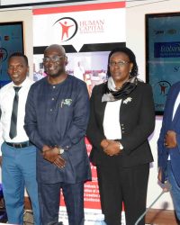 Dei-Tumi (centre) lines up with representatives of major sponsors of the upcoming summit